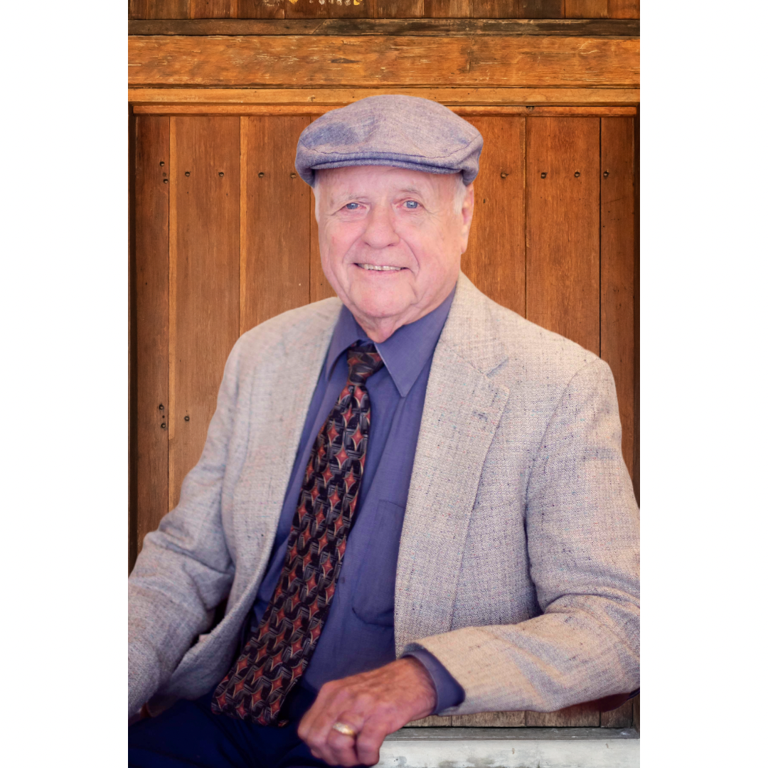 Darrell Sehorn associate at RE/MAX Hometown in Pampa, TX wearing a gray suit and a gray hat